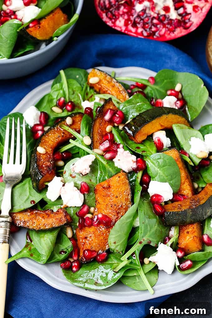 Sweet Roasted Kabocha Squash Salad - with creamy goat's cheese and a tangy pomegranate dressing. A deliciously filling dinner - perfect for Meatless Monday!