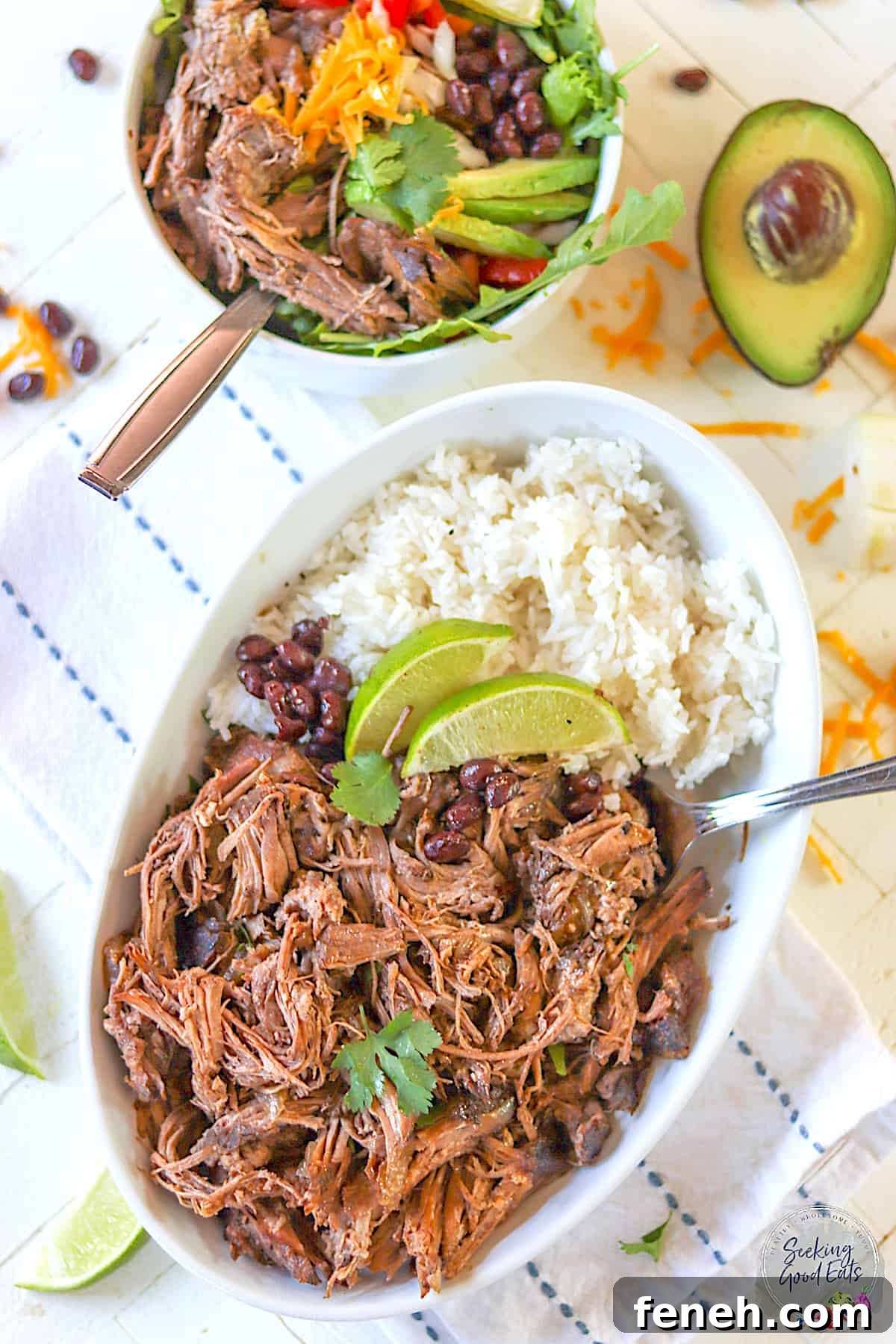 Barbacoa beef served with rice in an oval dish or as a salad in a white bowl