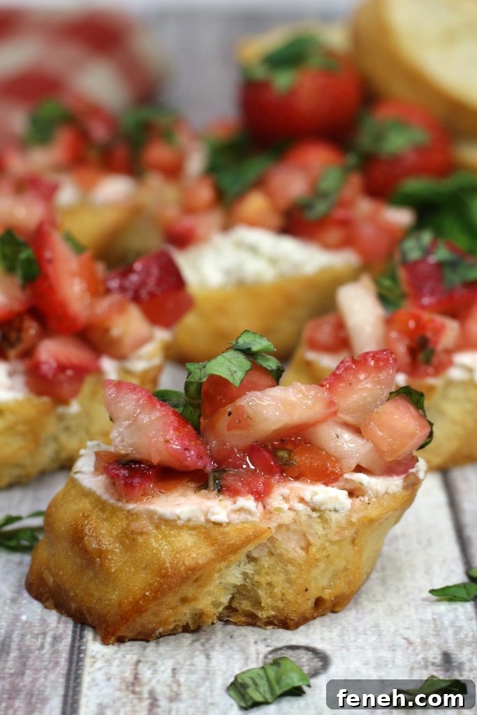 strawberry bruschetta on toasted baguette sliced spread with creamy goat cheese