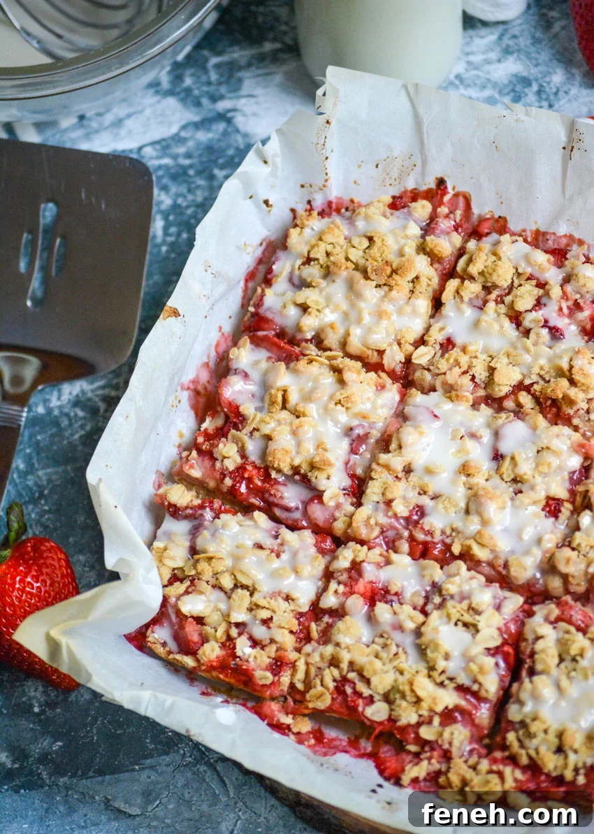 healthy strawberry oat bars on parchment paper and cut into squares