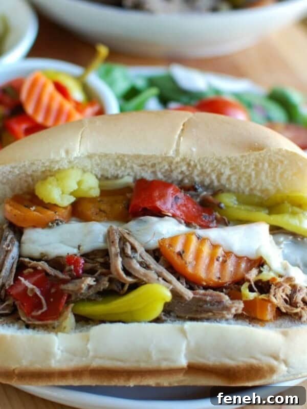 Slow Cooker Italian Beef Sandwiches on a white plate and on a bun