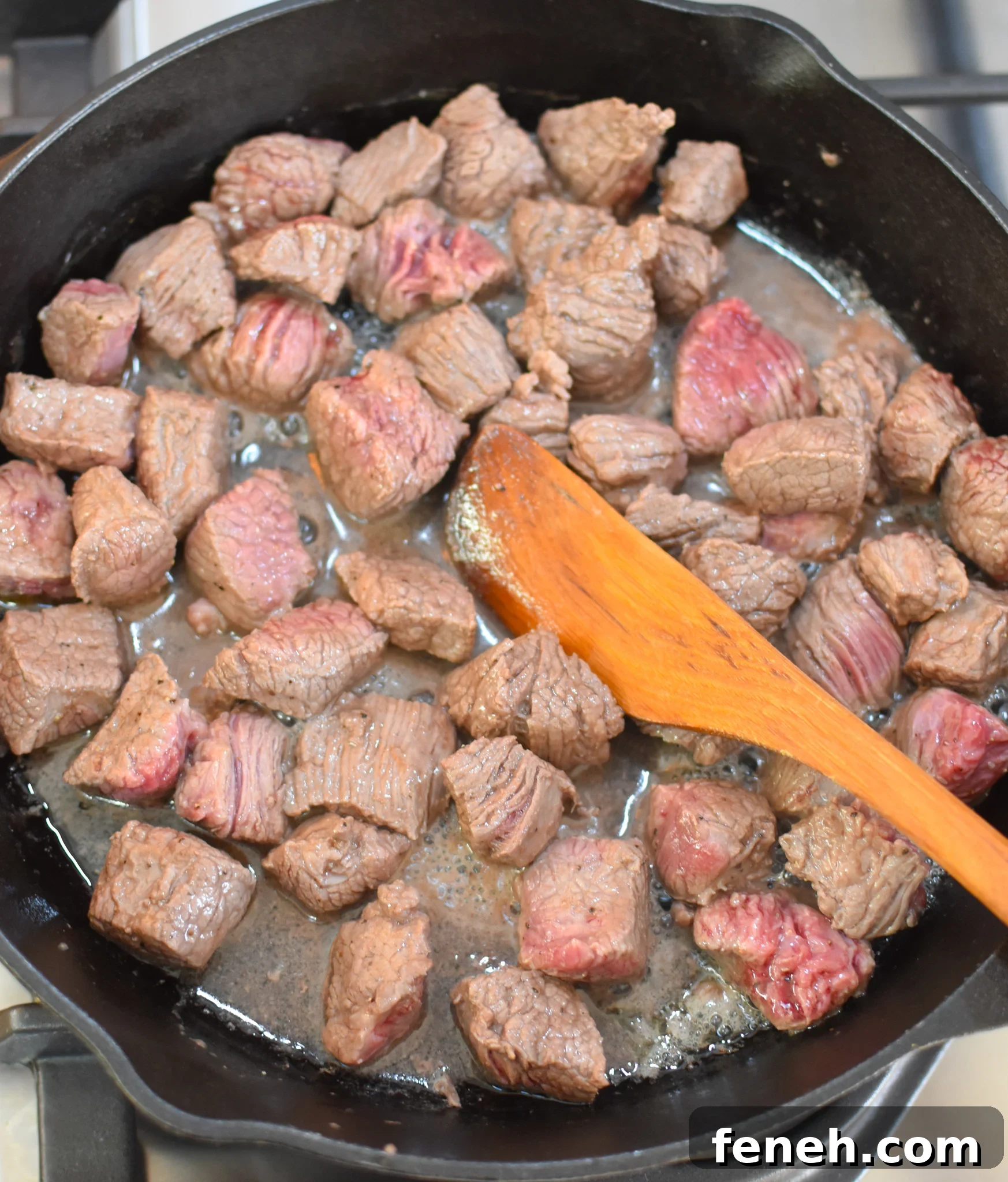 browning meat in a cast iron pan