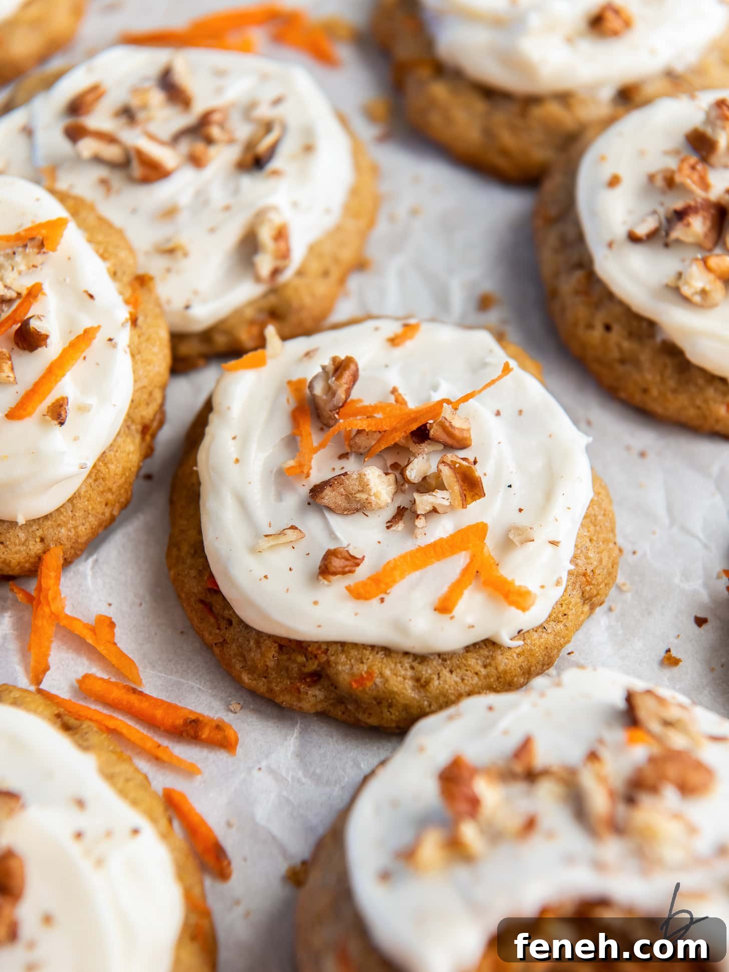 carrot cake cookie with cream cheese frosting and walnut garnish.