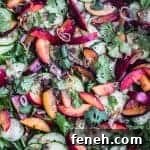 Plum & Cucumber Salad with Roasted Ginger Vinaigrette all done, topped with cilantro and crispy shallots.
