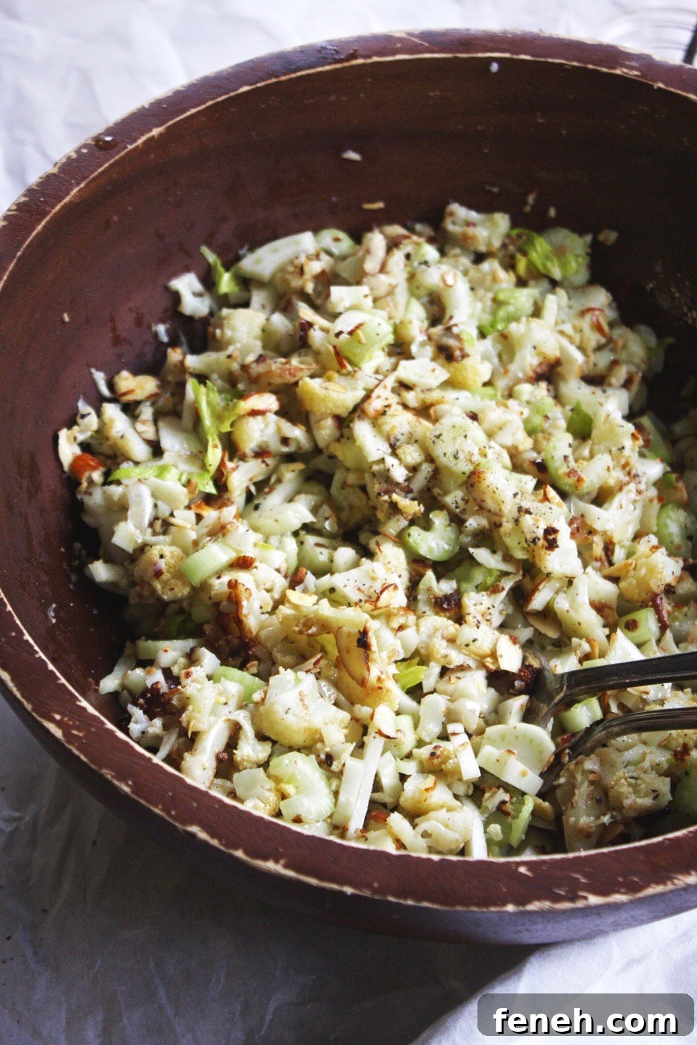 Chopped Cauliflower Salad - Tender roasted cauliflower diced up and tossed with celery, almonds, and fennel and drizzled with a delicious lemon vinaigrette! Such a hearty and delicious salad that’s perfect for fall! TheGarlicDiaries.com