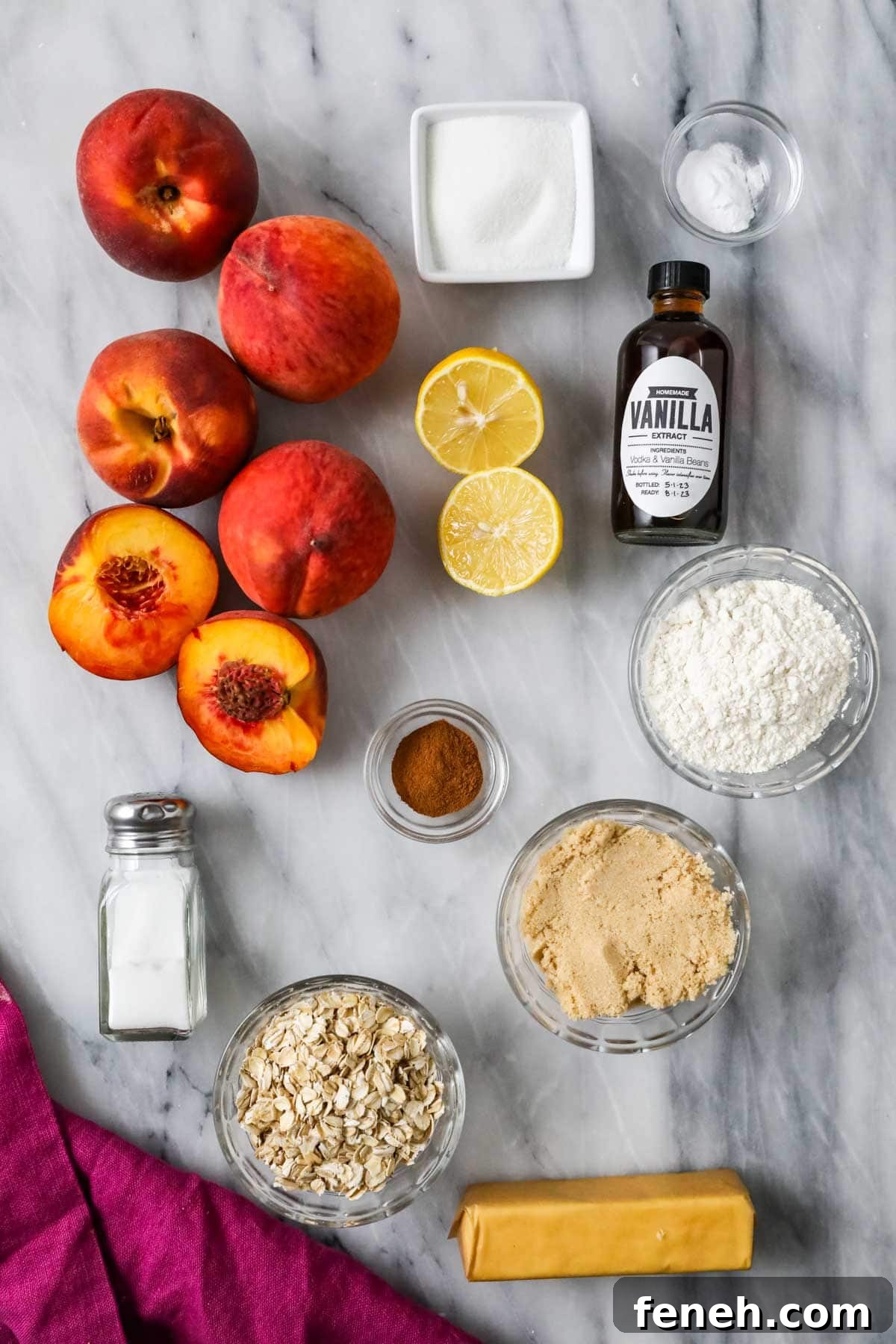 Overhead view of ingredients including peaches, oats, butter, and more.