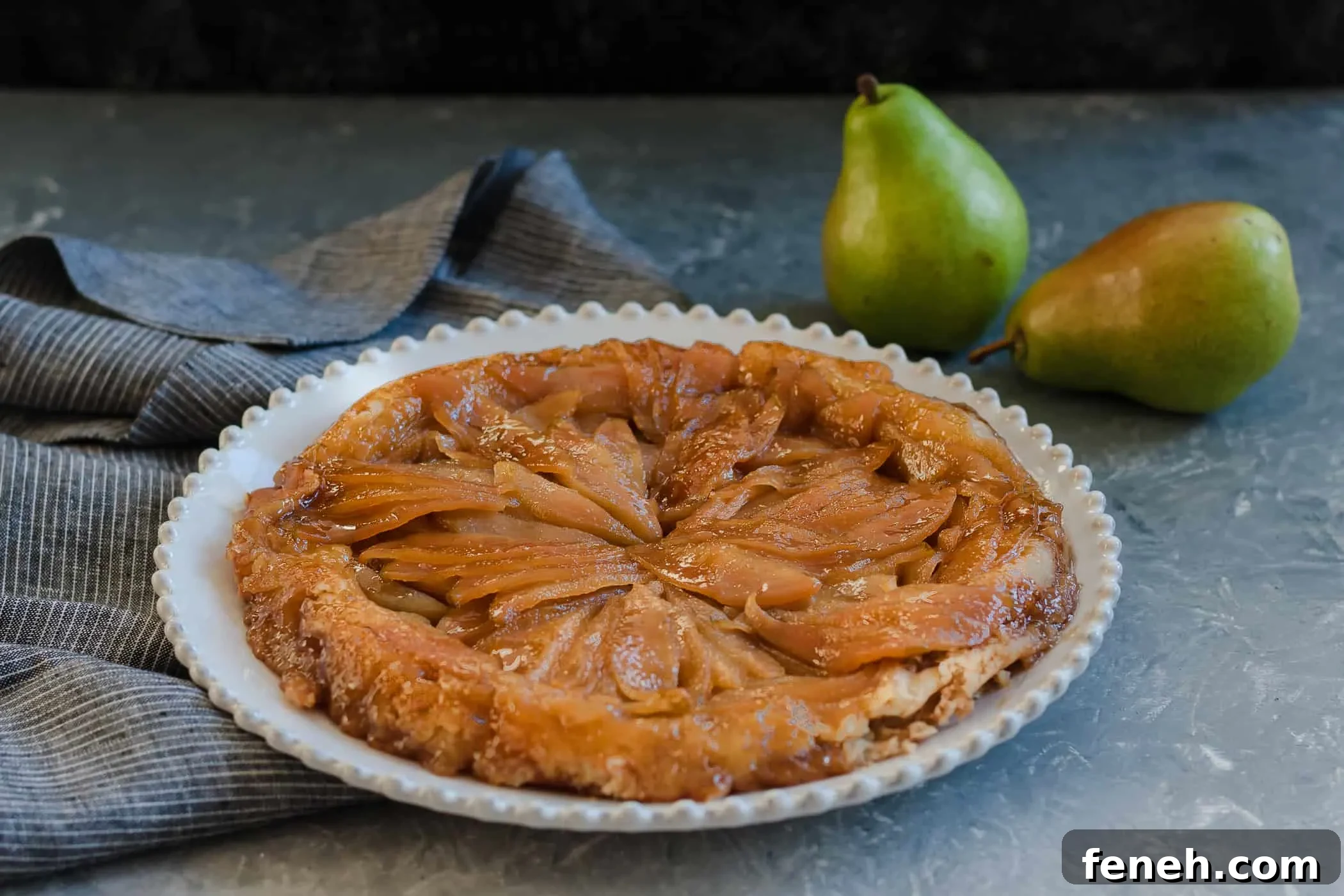 A unique seasonal fall dessert, caramelized pear upside down pie is a great reason to break out the cast iron cookware! * Recipe on GoodieGodmother.com