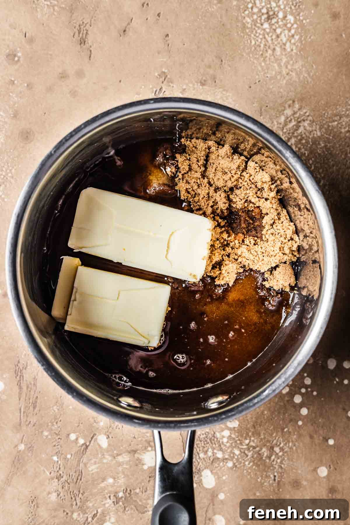 A pot with unmelted butter and brown sugar.