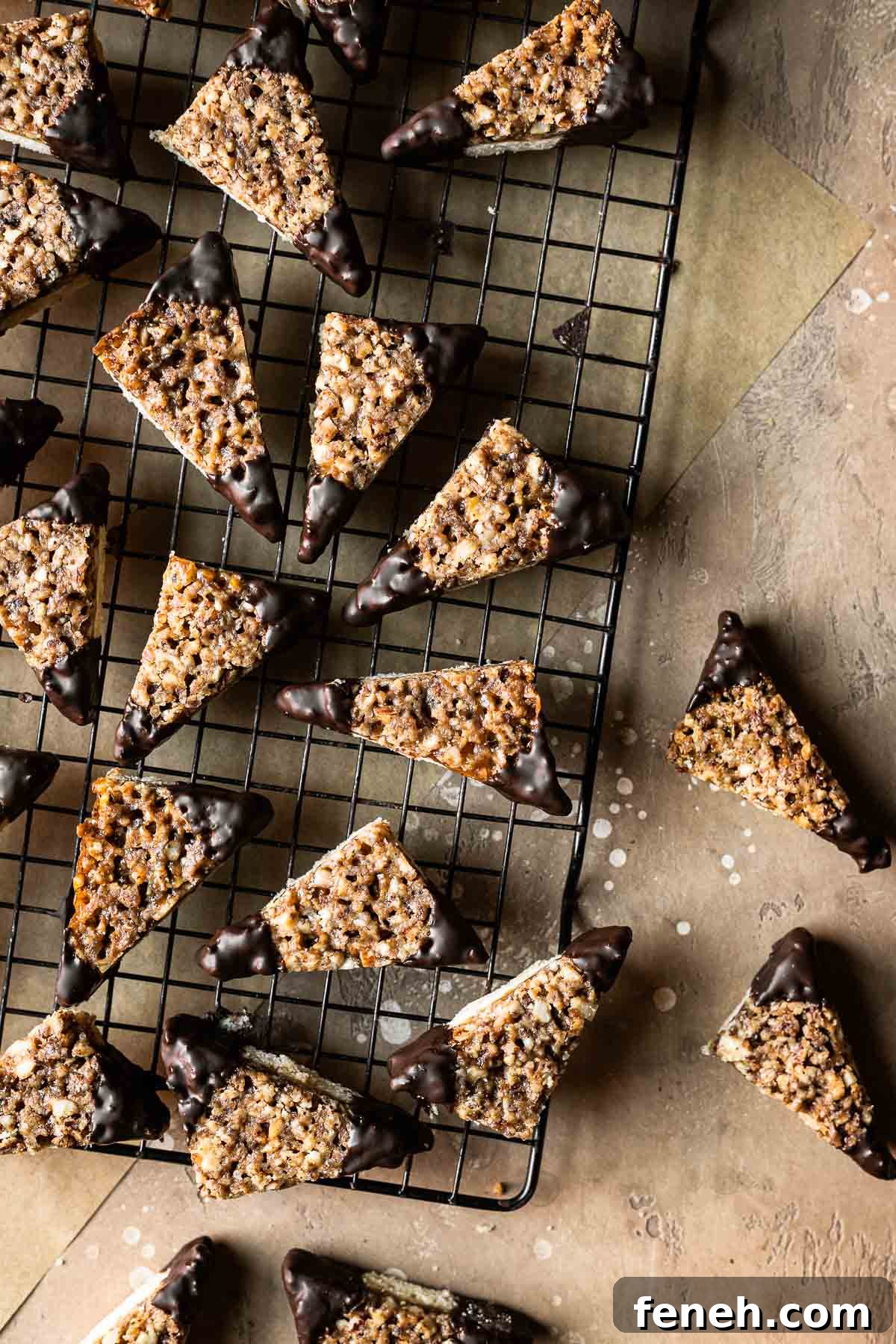 German nut corners dipped in chocolate on a cookie rack.