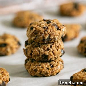 3 breakfast cookies stacked on each other with the other cookies around it.