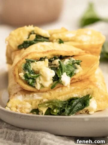 spinach and feta omelette stacked on a plate