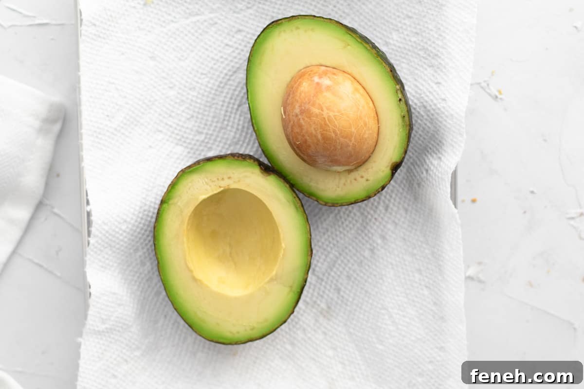3-Ingredient Dunkin’ Style Avocado Toast Recipe 4 ripe avocado cut in half.