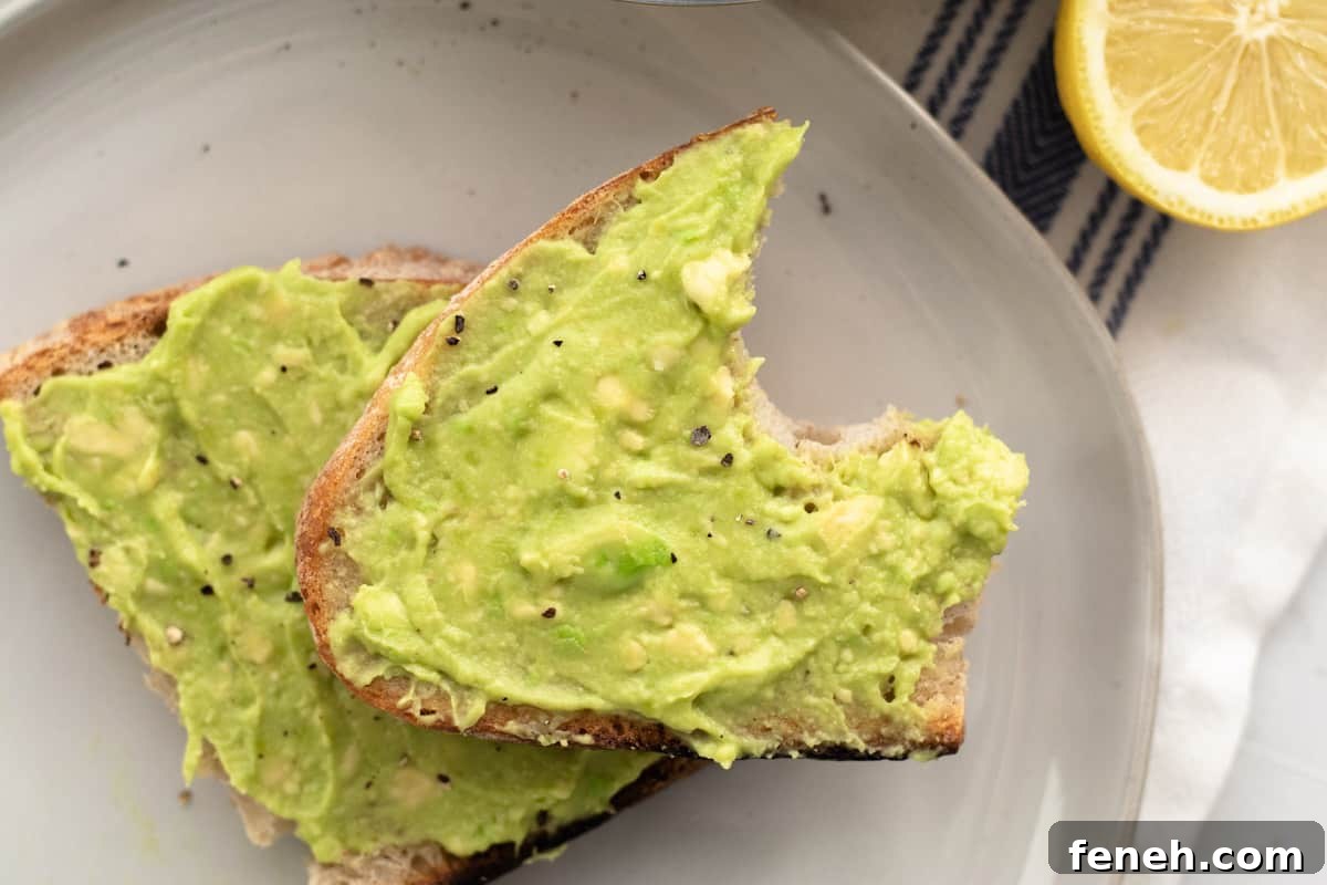 3-Ingredient Dunkin’ Style Avocado Toast Recipe 9 avocado toast with a bite taken out of it