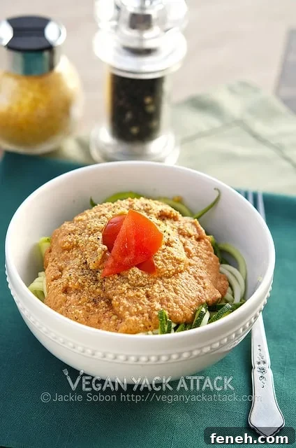 Raw Creamy Tomato Basil Pasta: A delectably light summer meal of zucchini noodles entangled with a raw, creamy tomato basil sauce.