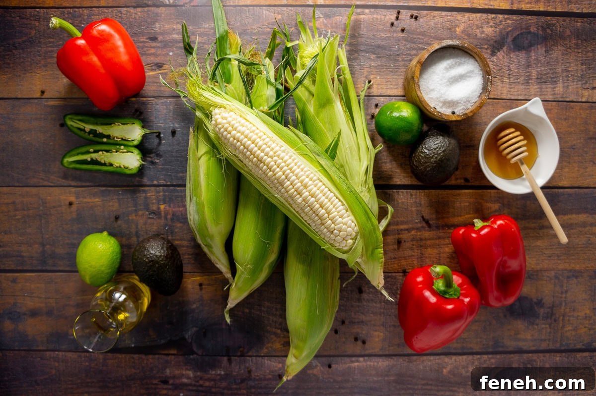 Ingredients for making an avocado corn salad with roasted red peppers and lime dressing.
