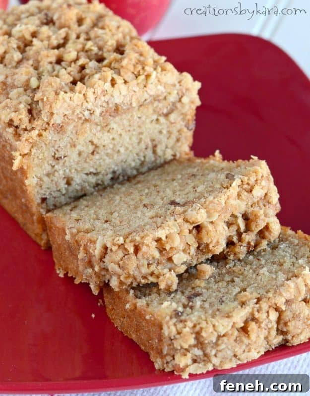 sliced applesauce bread with crumb topping on a red plate