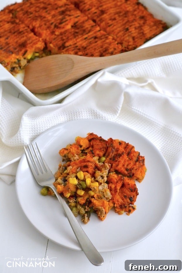 sweet potato shepherd's pie with ground turkey in a white casserole dish