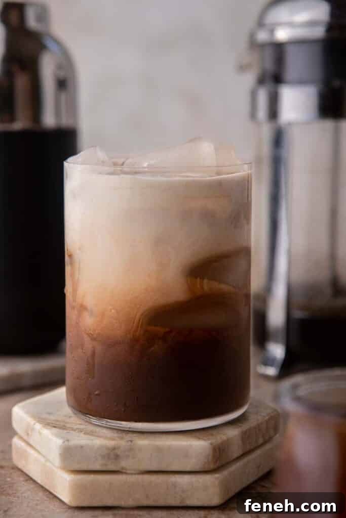 Iced mocha coffee with creamer on top