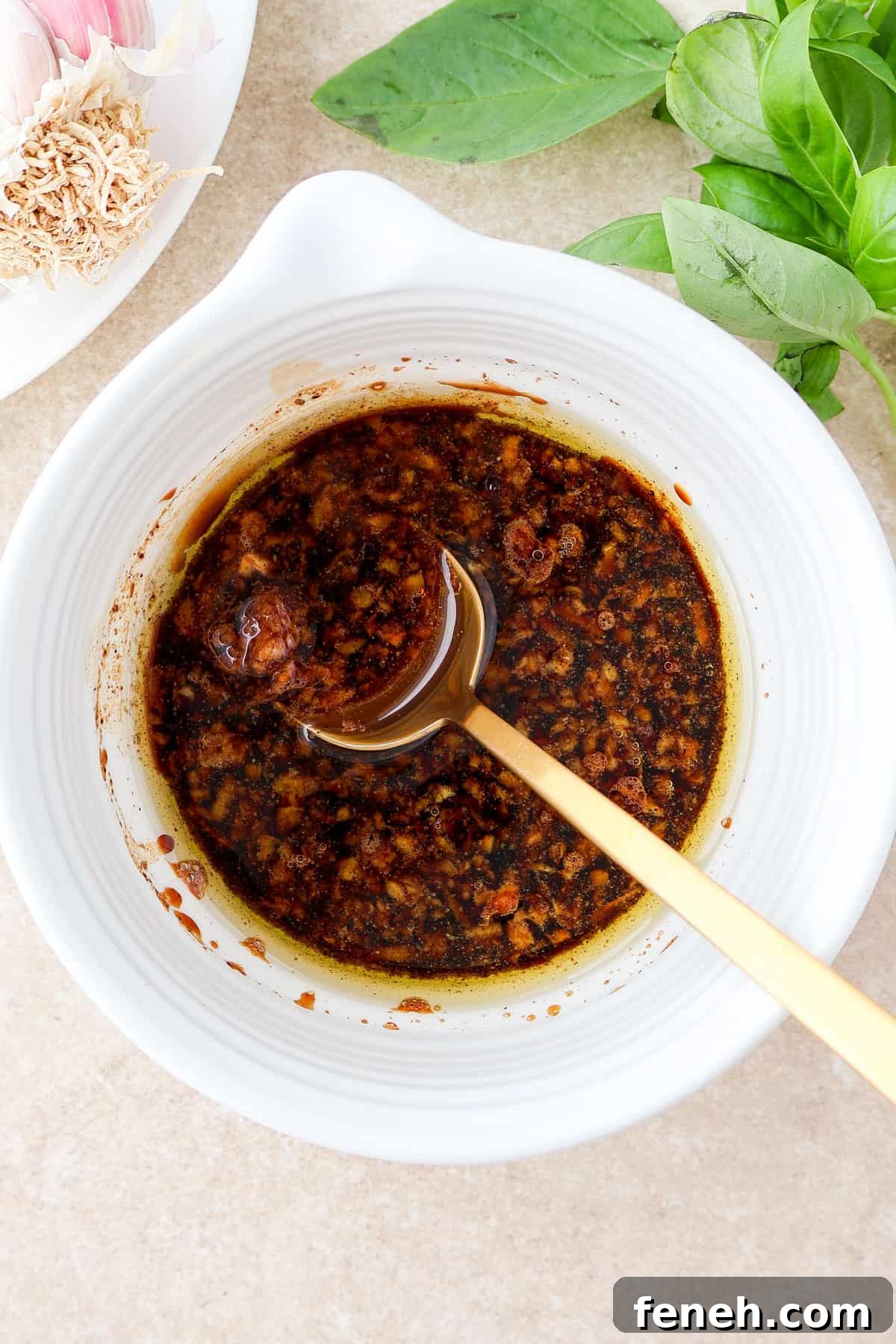 Balsamic garlic dressing in a small dish.