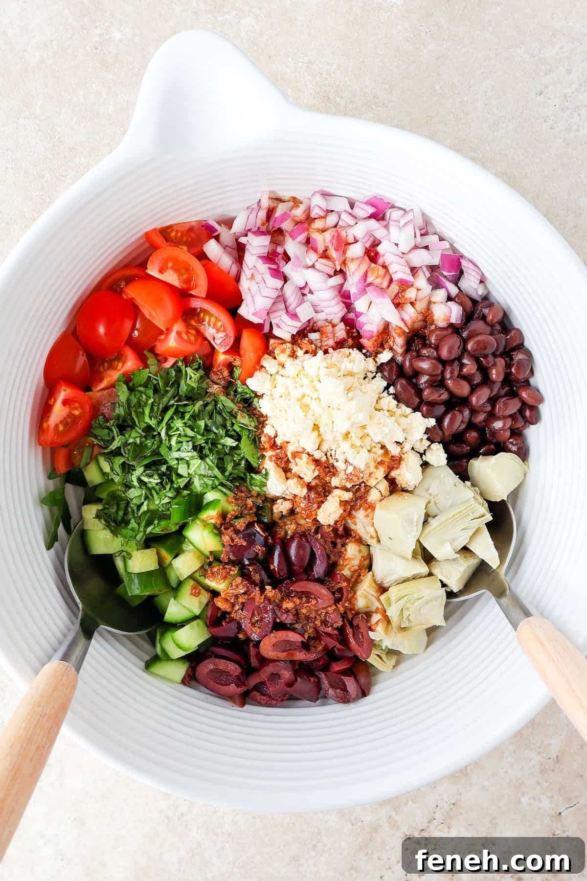 Ingredients in a mixing bowl with spoons.