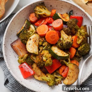 oven roasted vegetables in a bowl with a grey napkin.
