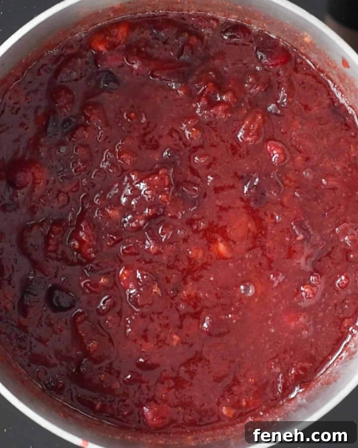 cranberries in a saucepan after being mashed