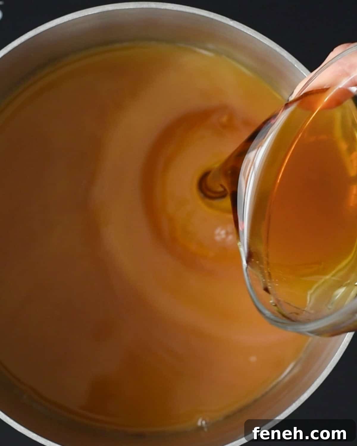 pouring honey into the saucepan