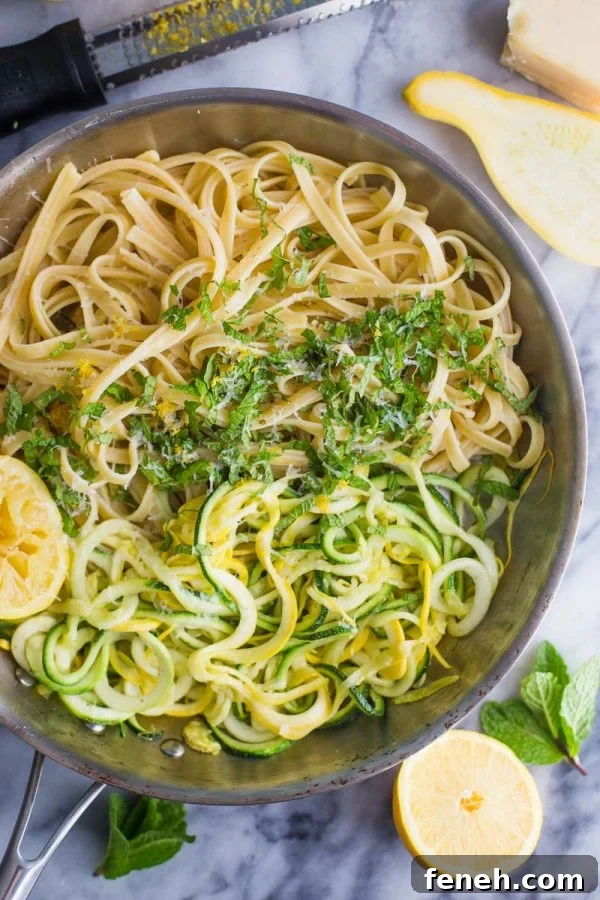 Zucchini Linguine- this easy vegetarian dinner is made with linguine and spiralized zucchini noodles for a meal that's delicious and filling for the whole family!
