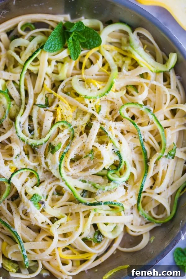 Zucchini Linguine- this easy vegetarian dinner is made with linguine and spiralized zucchini noodles for a meal that's delicious and filling for the whole family!