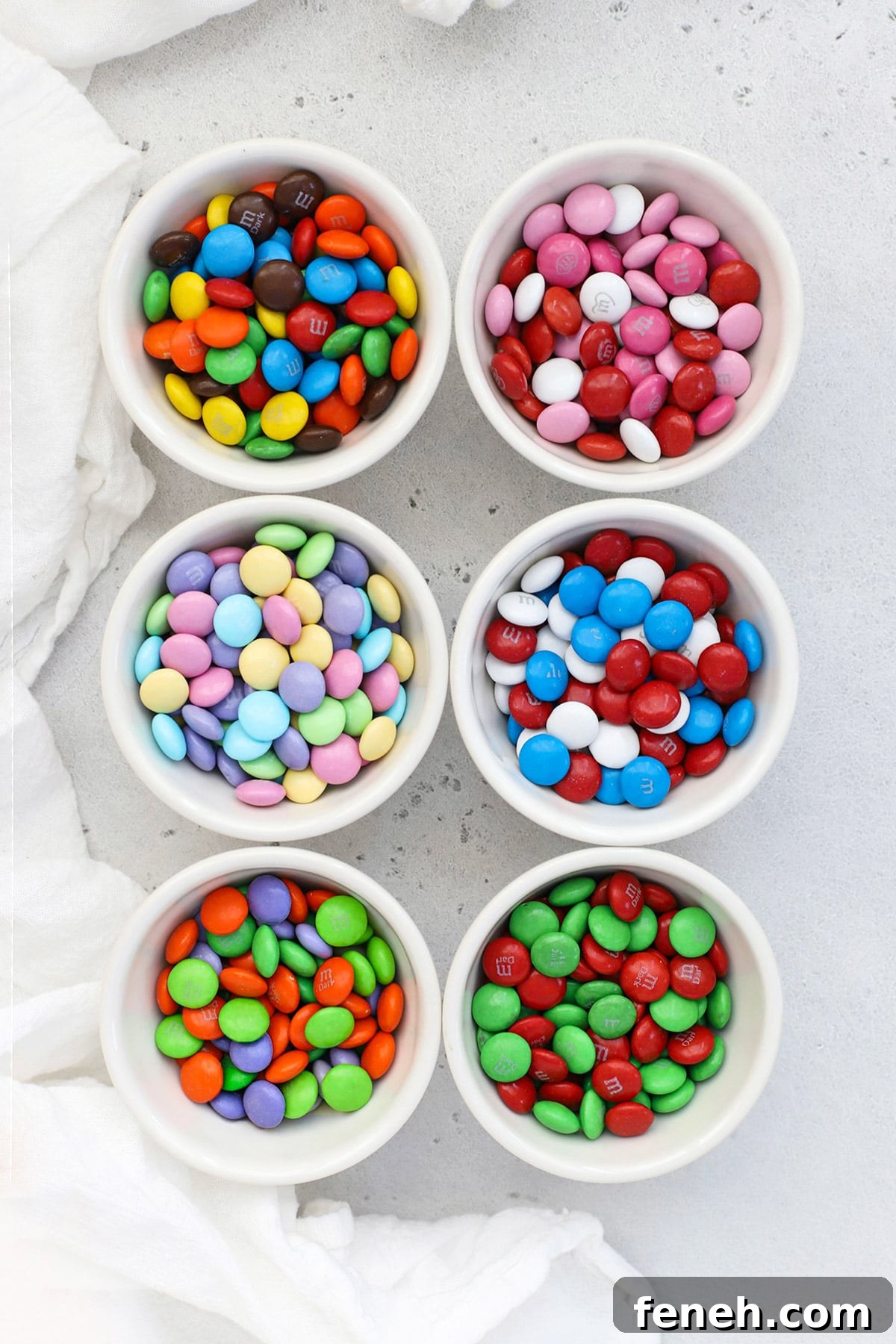 Overhead view of small bowls of holiday m&ms