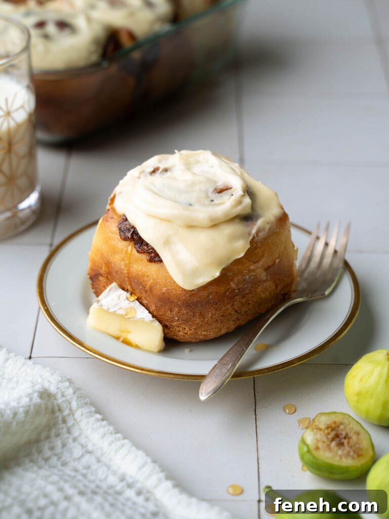 A fig and brie cinnamon roll on a plate