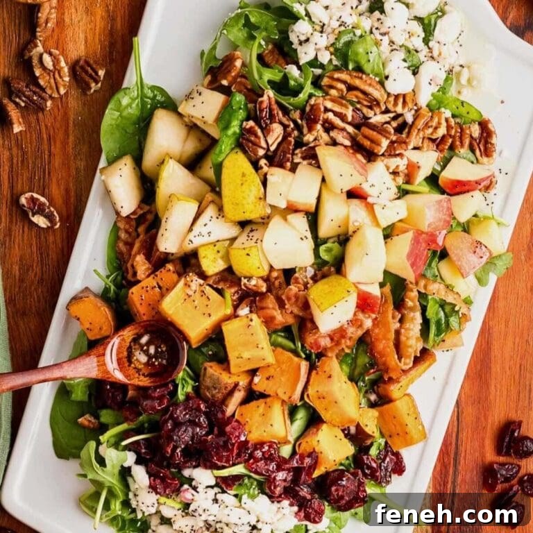 Harvest salad on a serving platter with poppy seed vinaigrette.