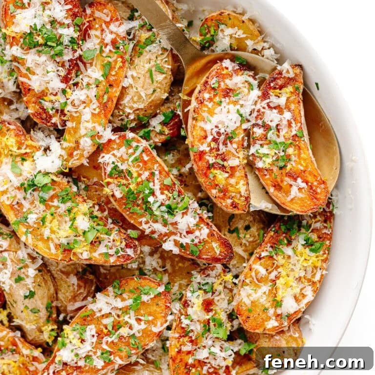 Parmesan truffle roasted fingerling potatoes in a white serving bowl.