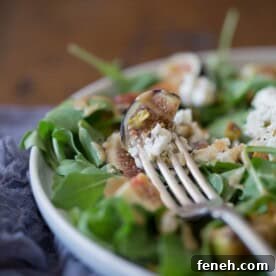 This fig goat cheese salad with fig vinaigrette is the perfect late summer salad. Packed full of fresh figs, goat cheese, pistachios and a homemade fig vinaigrette.