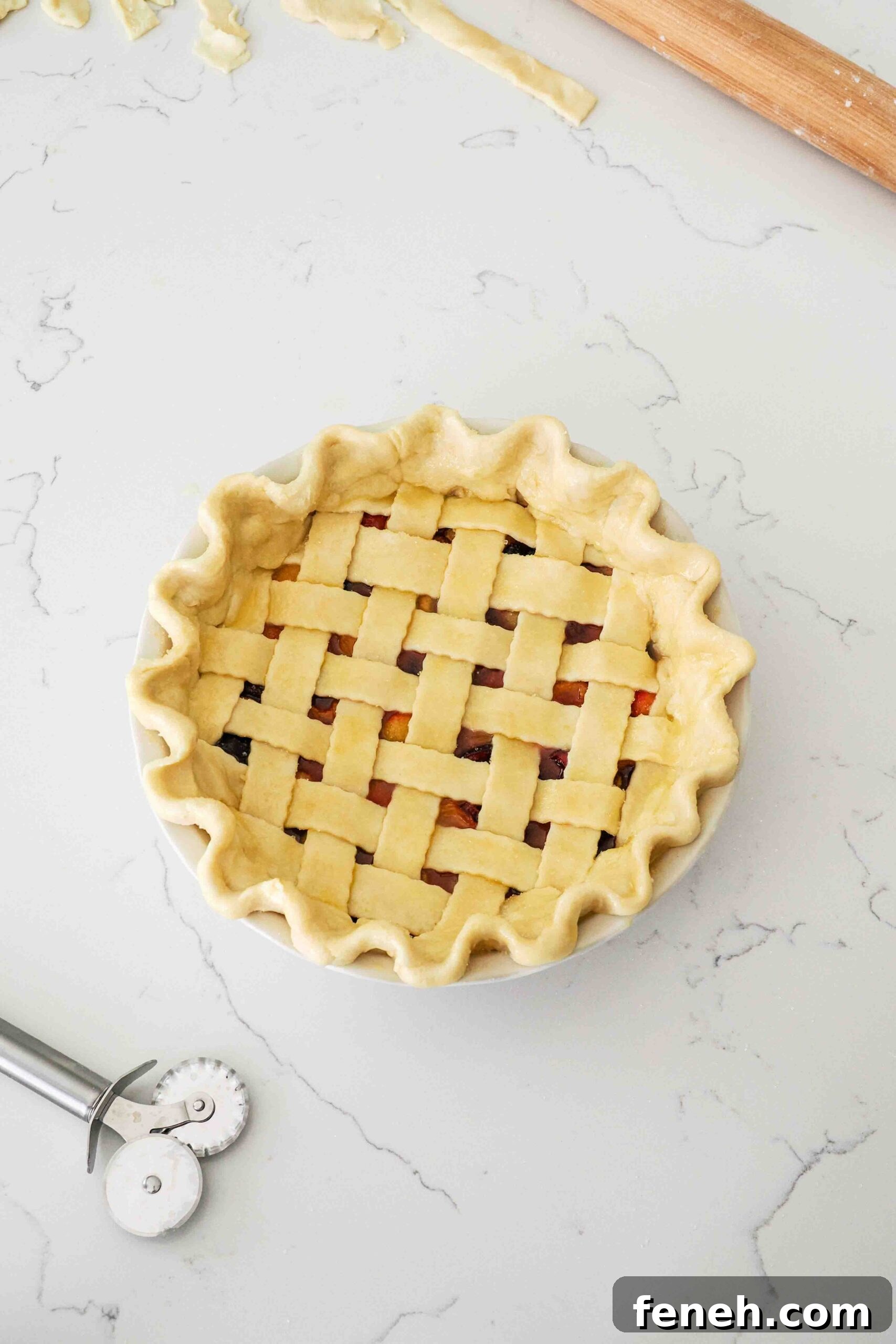 An unbaked cherry pie ready to bake.