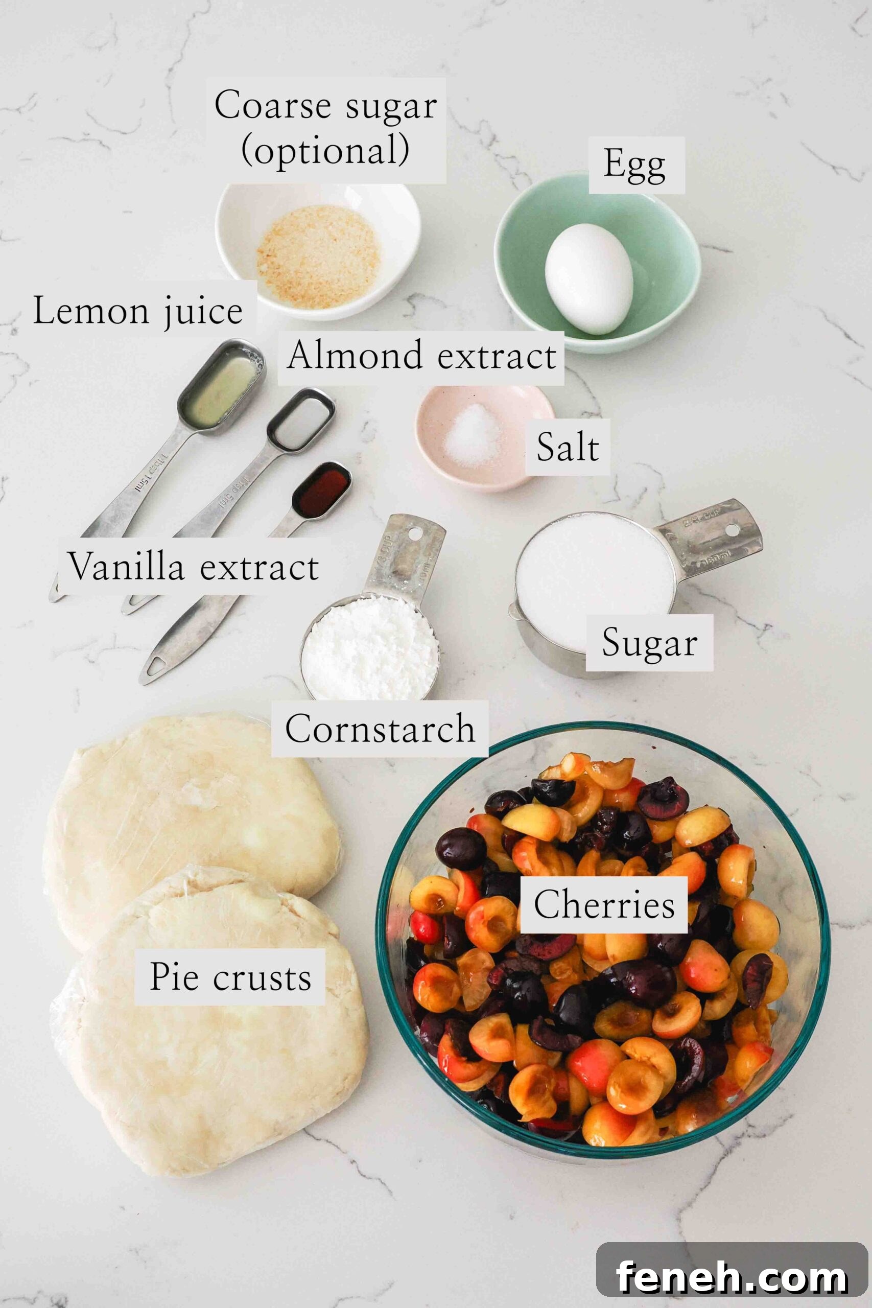Ingredients for cherry pie with almond extract on a quartz countertop.