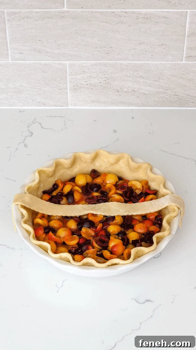 A cherry pie has its lattice arranged strip by strip.