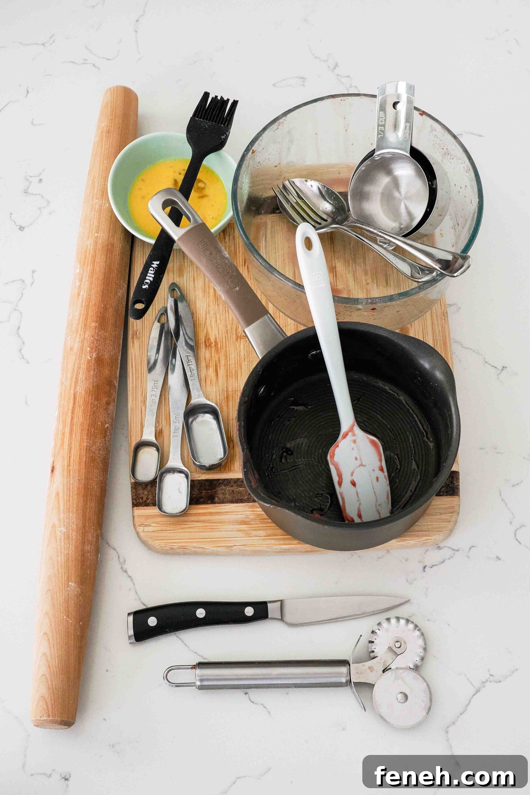 Dishes used to make cherry pie with almond extract.