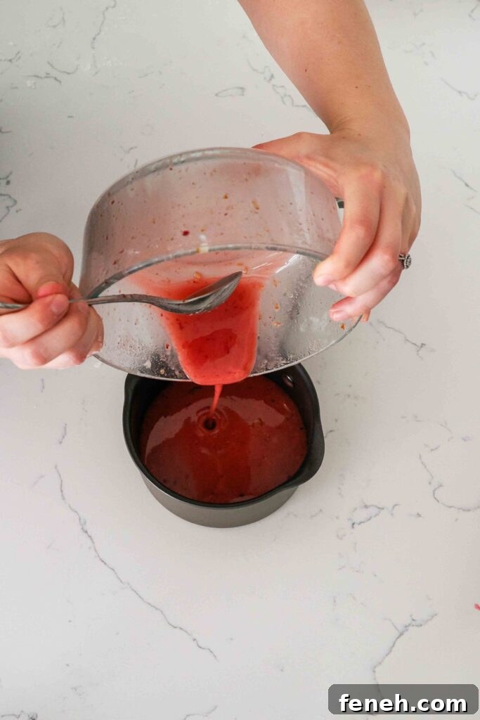 Leftover red cherry juice is poured into a saucepan.