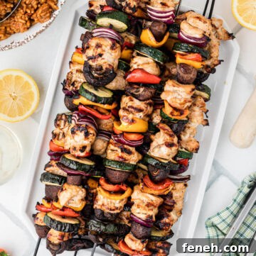 grilled chicken kebabs on a serving platter