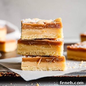 White chocolate millionaire shortbread on a piece of baking paper.