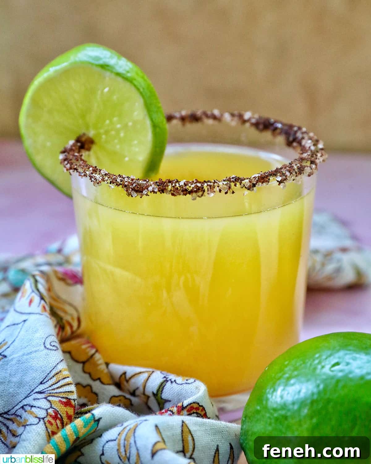 Spicy Mango Margarita in a glass with lime