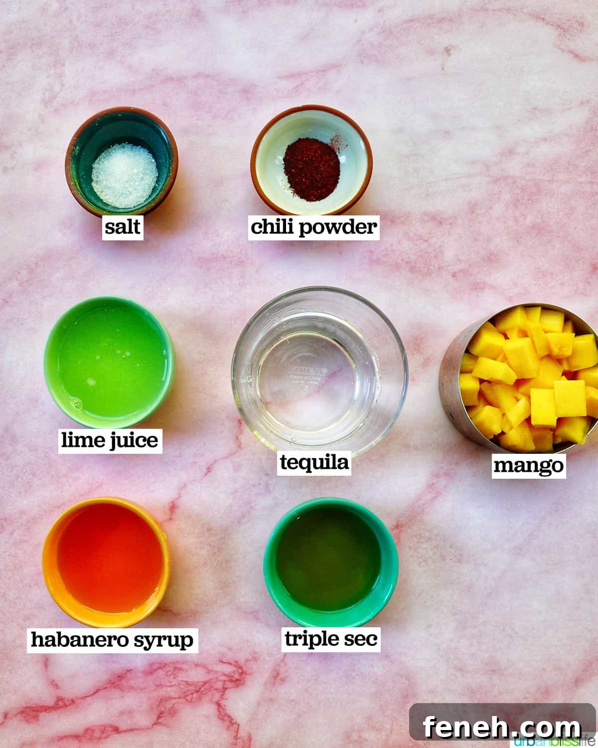 Bowls of ingredients for spicy mango margaritas