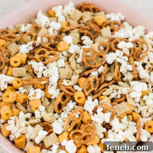 vegan and gluten-free chex mix in a large pink bowl