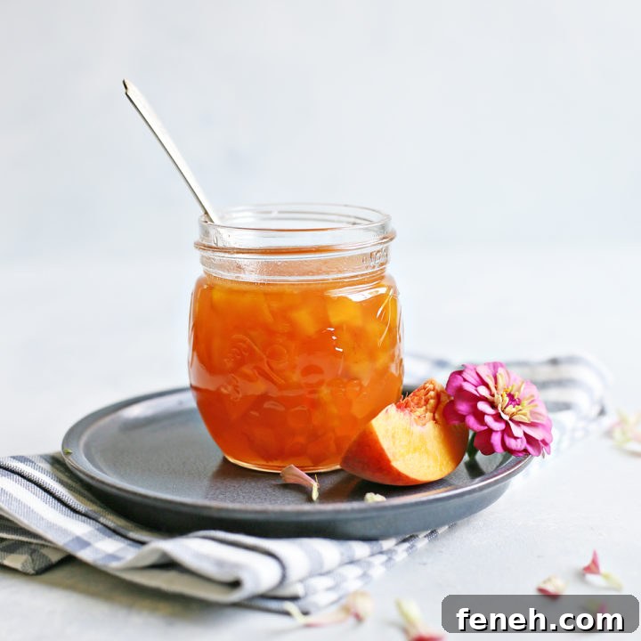 homemade peach syrup in a jar