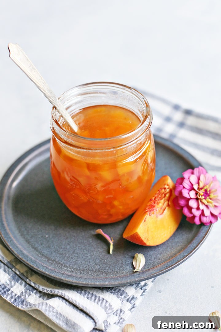 Peach syrup in a jar with fruit