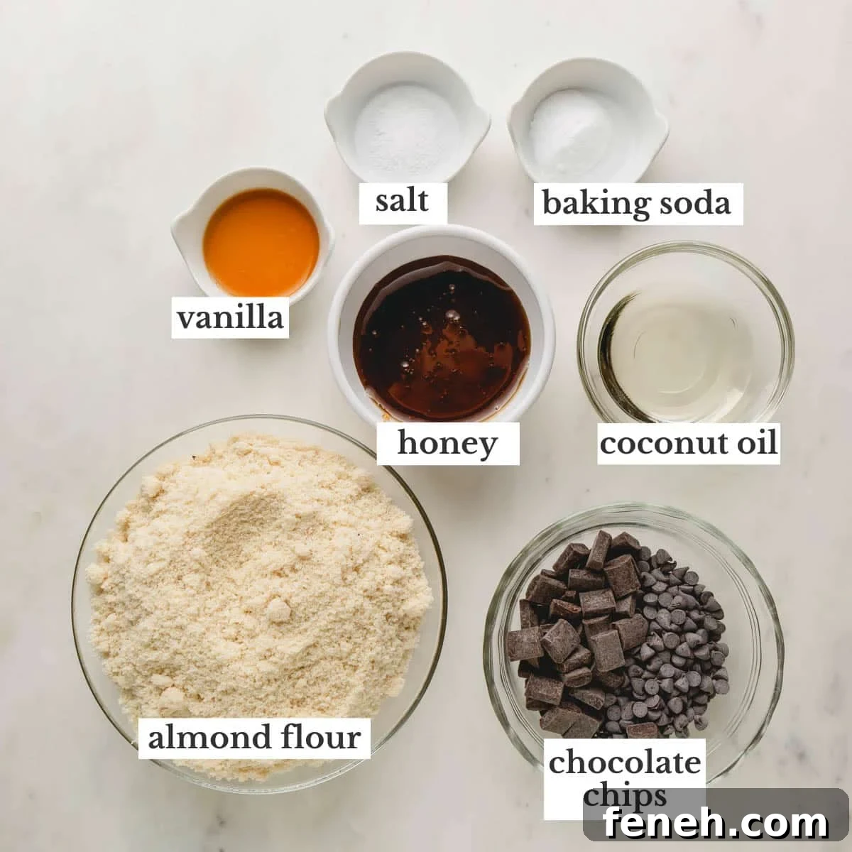Ingredients to make almond flour cookies with chocolate chips and chocolate chunks.