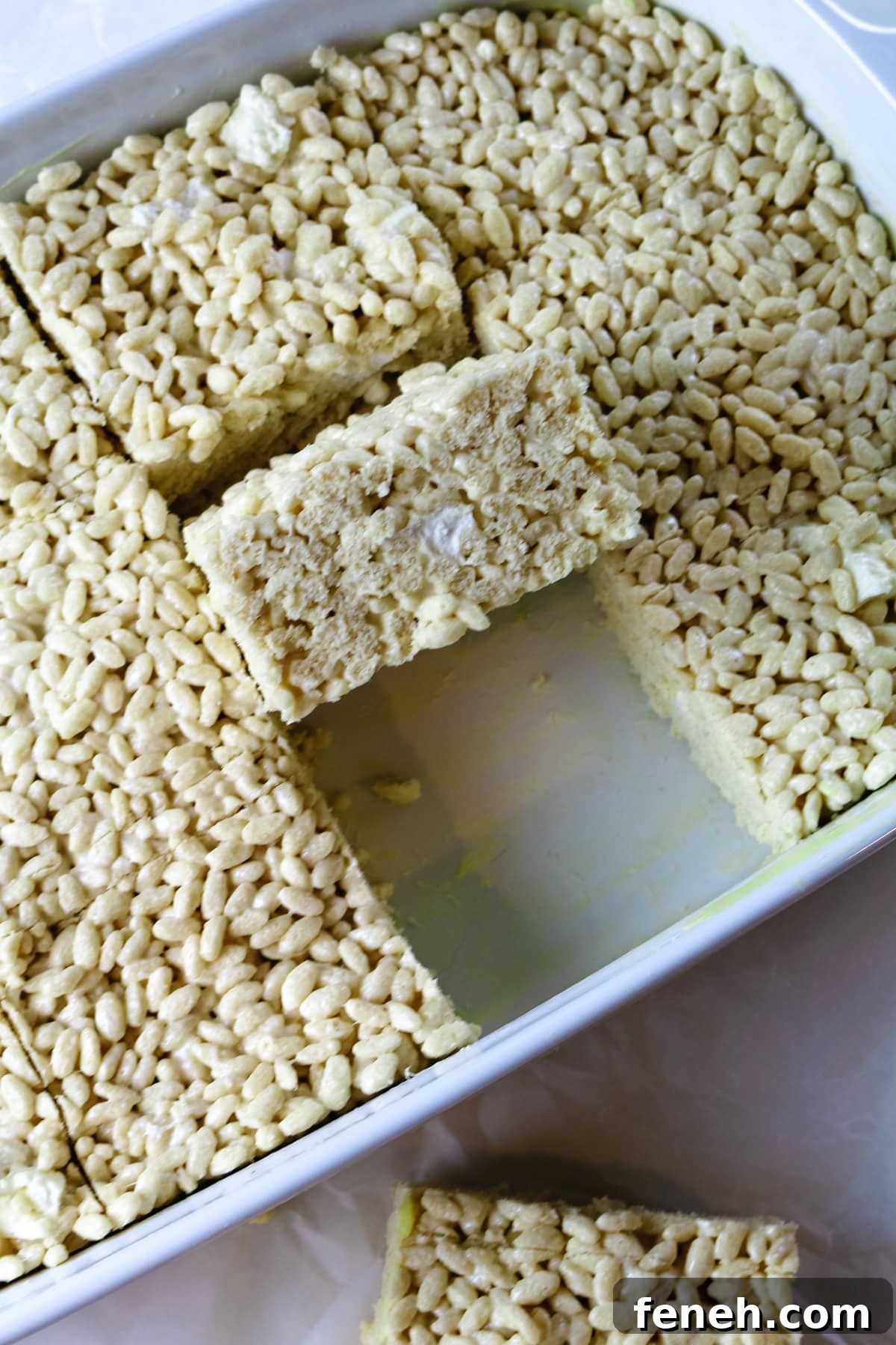 casserole pan with rice crispy treats, one missing piece.
