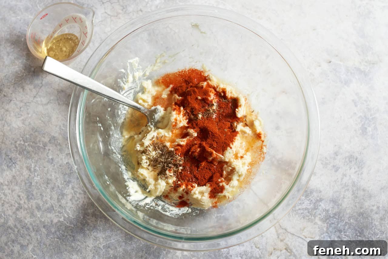 A camembert cheese mixture with beer sprinkled with paprika and caraway seeds.