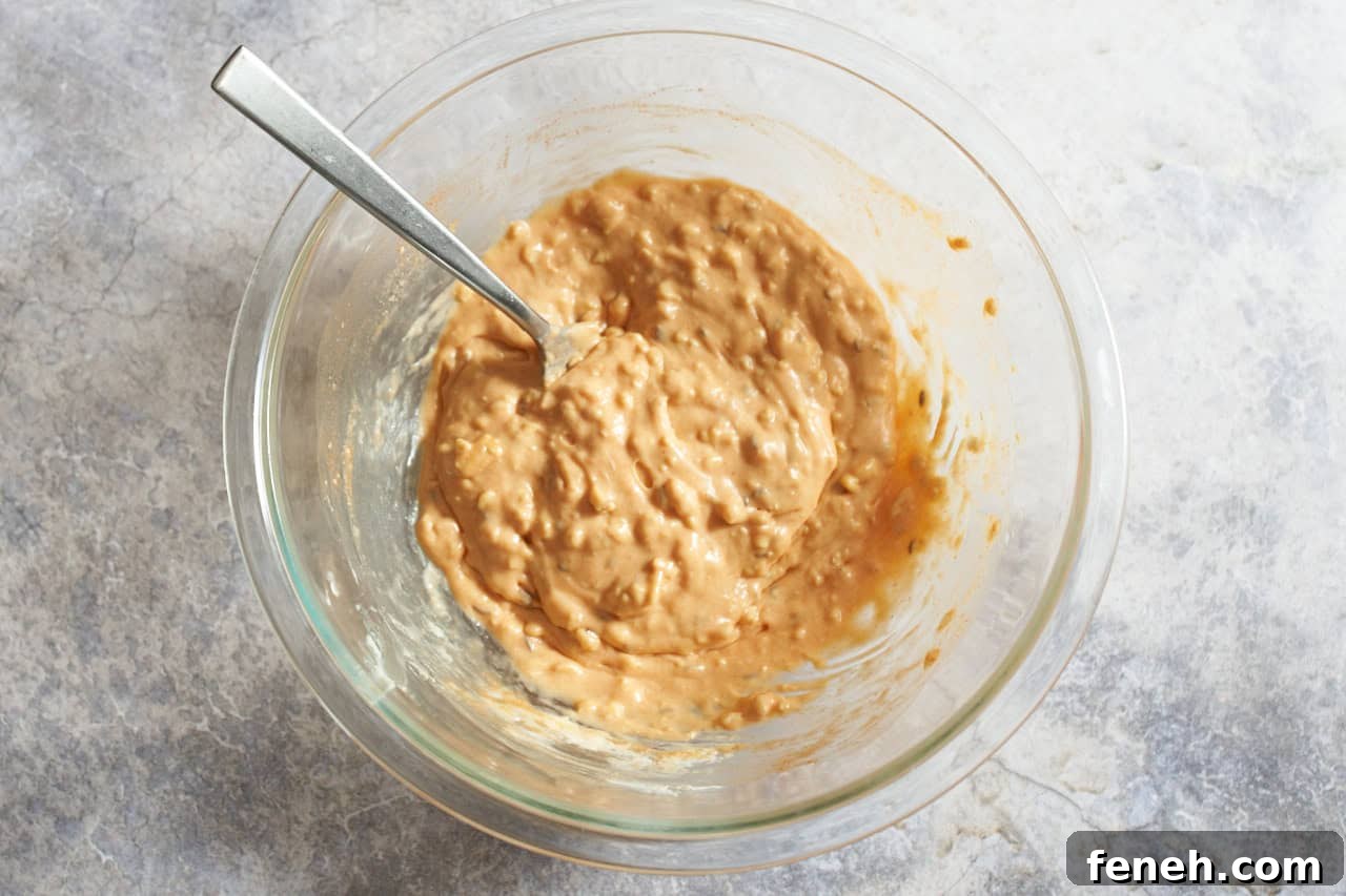 Obatzda cheese spread fully mixed together in a bowl with a fork.
